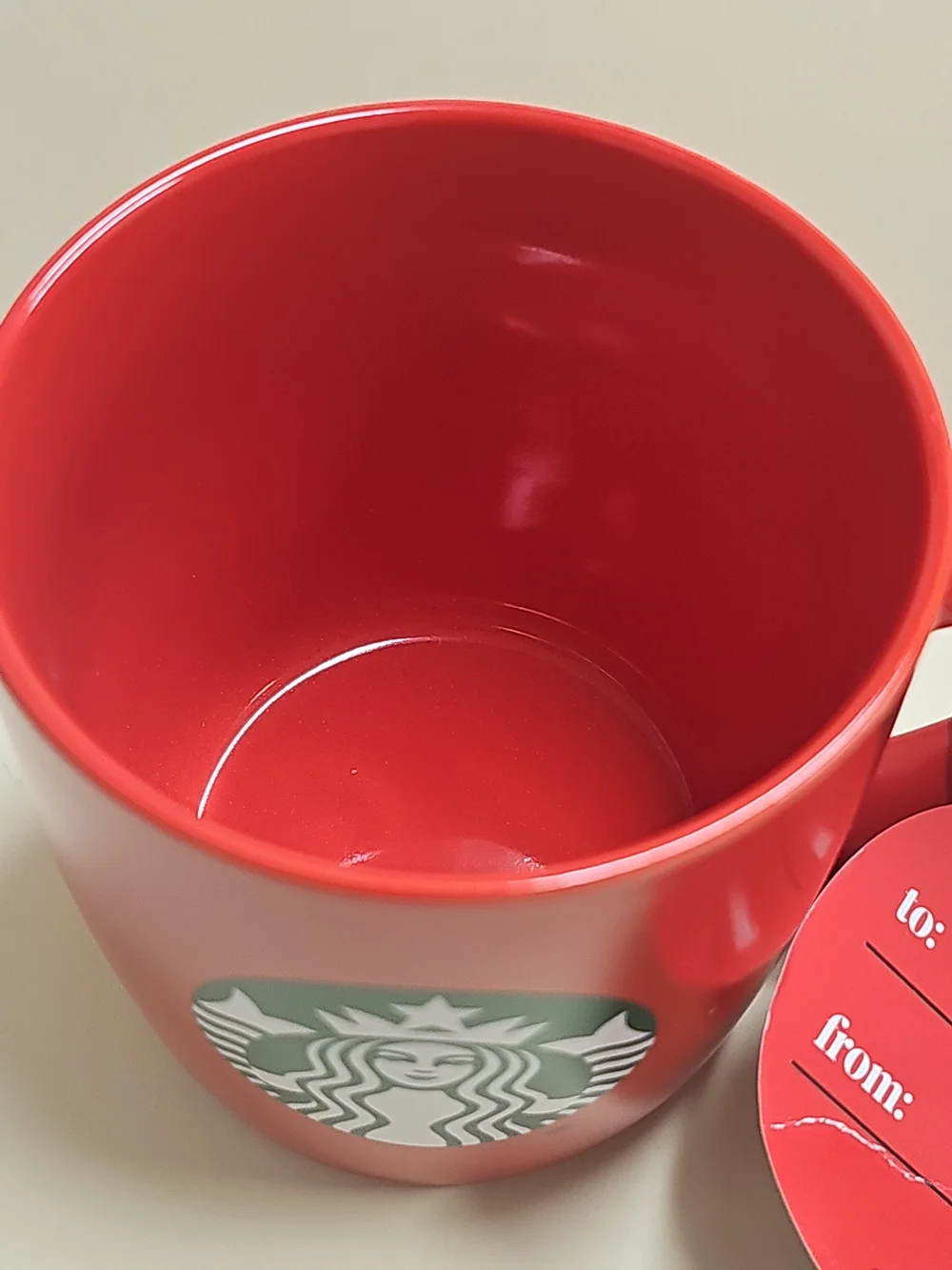 New STARBUCKS 2025 Christmas HOLIDAY Red MUG with gift tag